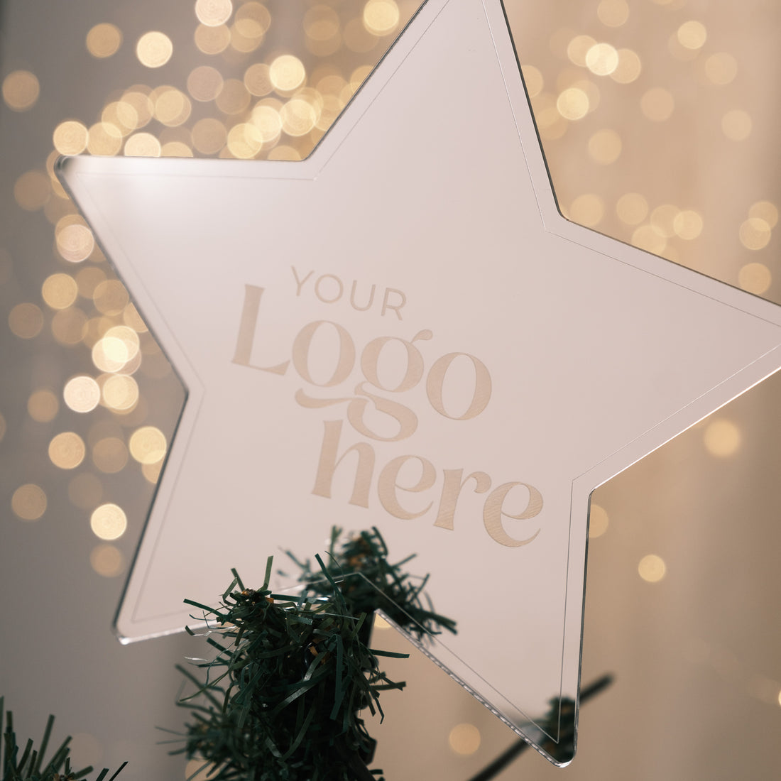 christmas tree topper company logo